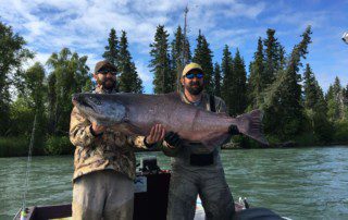 Come fishing in Alaska to catch king salmon like this Two men holding a large king salmon