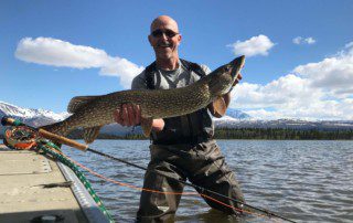 single-angler-posing-pike-fish-boat-wade-2022-2-1