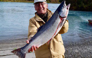single-angler-posing-silver-salmon-fish-bank-2022-2-1
