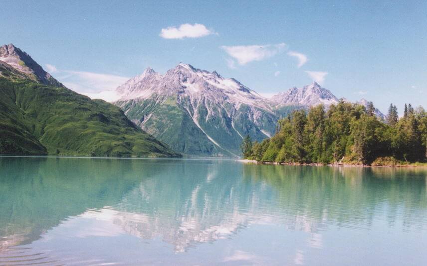 Mountains reflected in water in Lake Clark National Park