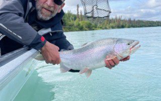 single-angler-posing-rainbow-trout-fish-boat-2021-11-15
