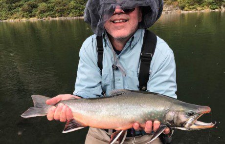 single-angler-posing-dolly-varden-fish-wade-2022-3-18 An angler displaying a fine looking dolly varden.