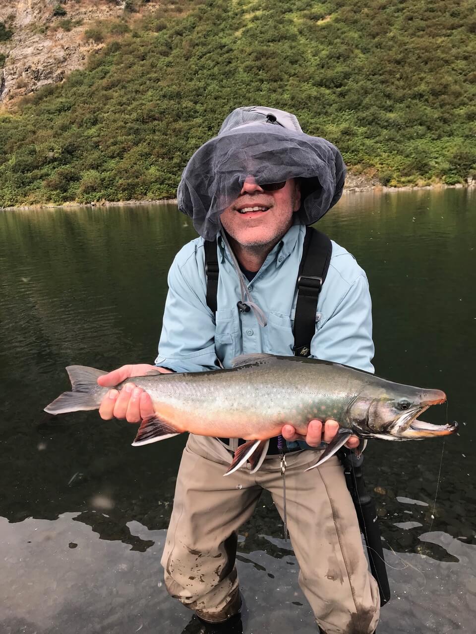 single-angler-posing-dolly-varden-fish-wade-2022-3-18 An angler displaying a fine looking dolly varden.
