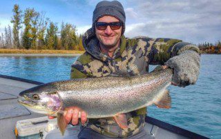 single-angler-posing-rainbow-trout-fish-boat-2022-5-13
